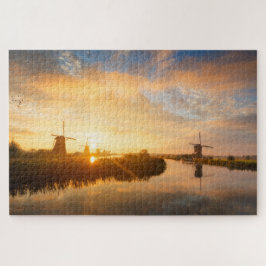 Puzzle Amanecer sobre molinos de viento y un río en Holan