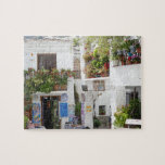 Puzzle Andalucía Calle peatonal España Europa Viaje<br><div class="desc">Esta pintoresca calle peatonal es un personaje exuberante con plantas de olla,  tiendas y un banco que muestra la belleza de este pueblo español.</div>