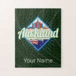 Puzzle Auckland New Zealand retro skyline vintage<br><div class="desc">Ciudad de Auckland en Nueva Zelanda con recuerdo de la época del skyline para las vacaciones en la isla. Auckland con horizonte retro en Nueva Zelanda como recuerdo para los maoríes y Tamaki Makaurau. Estilo de vida de Auckland para mochileros urbanos y viajes a Nueva Zelanda. Isla de Auckland y...</div>