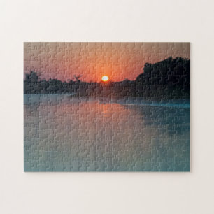 Puzzle Barca al amanecer en el río