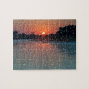 Puzzle Barca al amanecer en el río