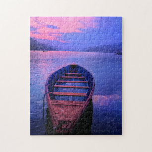 Puzzle Barco en lago tranquilo al atardecer