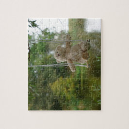 Puzzle Beertje op schommel aan boom