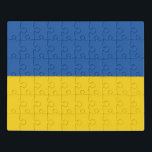 Puzzle Botón Bandera de Ucrania<br><div class="desc">La bandera de Ucrania es una bandera de dos bandas horizontales de igual tamaño de azul y amarillo. La parte superior representa el cielo y el amarillo representa el trigo.
La bandera nacional de Ucrania</div>