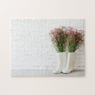 Puzzle Brotes de lluvia blanca y pared de ladrillo