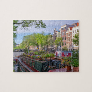 Puzzle Buildings and canal in Amsterdam, Netherlands