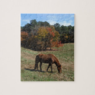 Puzzle Caballo marrón con árboles caídos