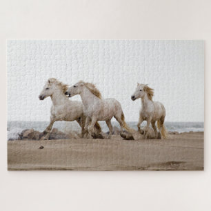 Puzzle Caballos de Camarga corriendo en la playa