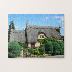 Puzzle Cabaña del tejado cubierto con paja en saltar
