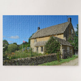 Puzzle Cabaña inglesa con el jardín y la bandera