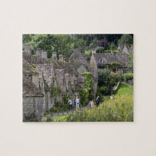 Puzzle cabañas de piedra de Cotswold en el pueblo de