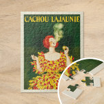 Puzzle Cachou Lajaunie | Leonetto Cappiello<br><div class="desc">Cachou Lajaunie (1920) | El poster de publicidad de 1920 de Leonetto Cappiello para Cachou Lajaunie muestra una sorprendente imagen de una mujer de cabello rojo vestida con un vestido rojo y amarillo atrevido, fumando elegantemente contra un rico fondo verde oscuro. Los colores vibrantes y la postura dinámica de la...</div>