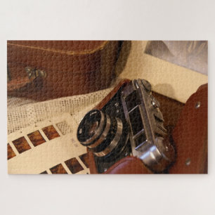 Puzzle Cámara analógica vintage en funda marrón de cuero