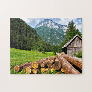 Puzzle Campamento de tala en el bosque con montañas
