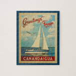 Puzzle Canandaigua Sailboat Vintage Travel New York<br><div class="desc">Este diseño náutico vintage de Greetings From Canandaigua New York incluye un barco navegando en el agua con gaviotas y un cielo azul lleno de hermosas nubes blancas.</div>