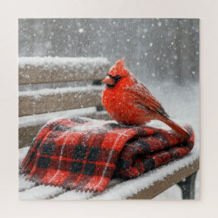 Puzzle Cardenal rojo sobre una manta de cuadros nevada