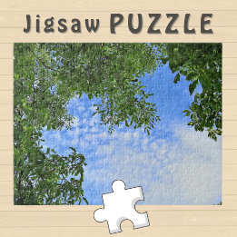 Puzzle Cielo azul rodeado de hojas de árbol verde Foto -