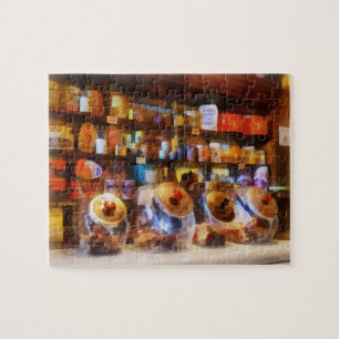 Puzzle Cuatro frascos de dulces de vidrio