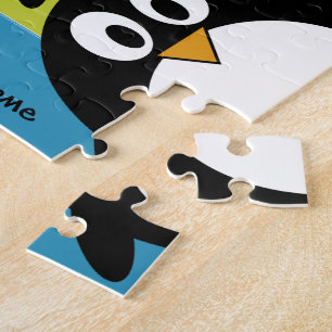 Puzzle Dibujo animado lindo del pingüino con el área para