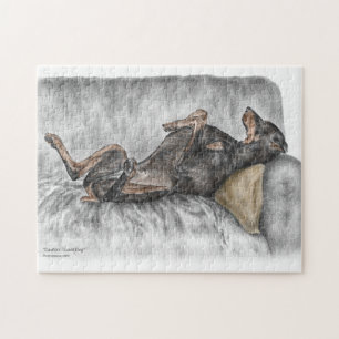 Puzzle Doberman gracioso en Sofa