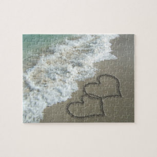 Puzzle Dos corazones de arena en la playa