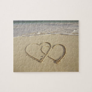 Puzzle Dos corazones sobre la playa
