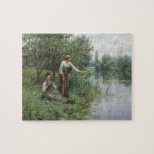 Dos mujeres pescando en la hierba junto al río