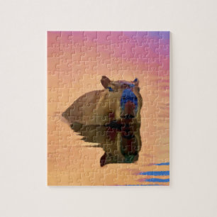 Puzzle El capibara emerge de un lago tranquilo