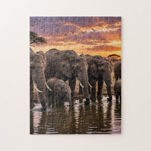 Puzzle Elefantes africanos en el abrevadero al atardecer