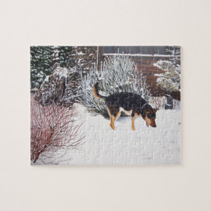 Puzzle Escena de nieve de invierno con perro negro lindo 