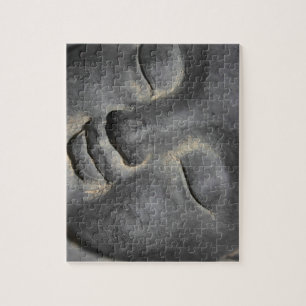 Puzzle Escultura de piedra de la cara del Buda suave
