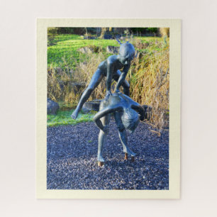 Puzzle Estatua de dos niños jugando