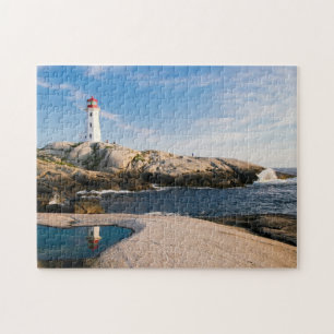 Puzzle Faro sobre rocas con reflexión oceánica
