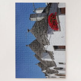 Puzzle Flores de geranio y casas de trullos en Alberobell