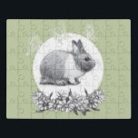 Puzzle Fluffy el conejo. Dibujo de lápiz<br><div class="desc">Dibujo a lápiz.Artista de Zolotareva.Fluffy el conejo.El dibujo un lápiz de liebre y flores de camóiles con aplicación de fondo verde claro y mariposas vectoriales.</div>