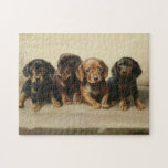 Puzzle Four Dachshund Puppies | Carl Reichert<br><div class="desc">Four Dachshund Puppies | Carl Reichert’s Four Dachshund Puppies is an enchanting painting that captures the innocence and charm of four small dachshund puppies. Rendered in neutral earth tones, the artwork highlights their soft fur and expressive faces, showcasing Reichert’s exceptional skill in creating lifelike animal portraits. The harmonious composition and...</div>