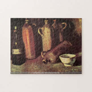 Puzzle Frasco de piedra de cuatro botellas y taza blanca