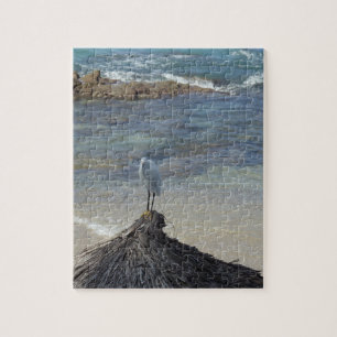 Puzzle Garza Blanca en el océano sentado en una cabaña.