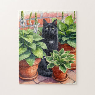 Puzzle Gato negro sentado en el jardín de hostas