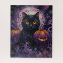 Gato negro y calabazas de Halloween a la luz de la
