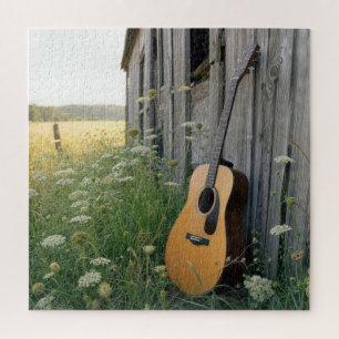 Puzzle Guitarra acústica apoyada en un granero rural