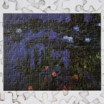 Puzzle Impresionismo vintage por Claude Monet<br><div class="desc">Waterlilies (1915) de Claude Monet es una pintura de la naturaleza de arte de estilo Art. Los tonos más oscuros implican que pintó esta obra maestra por la noche. Uno de los muchos cuadros de nenúfares que Monet pintó junto al estanque en su jardín de flores de temporada de primavera...</div>