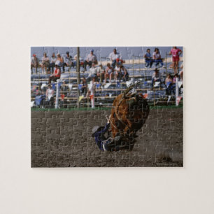 Puzzle Jinete de rodeo que cae de toro
