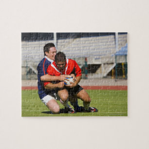 Puzzle Jugadores del rugbi que luchan para la bola