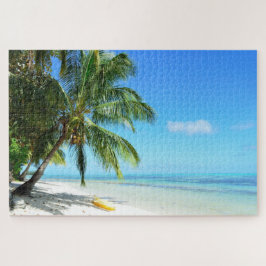 Puzzle Kajak amarillo en una playa blanca con la palma