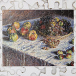 Puzzle La vida con manzanas y uvas de Claude Monet<br><div class="desc">Still Life with Apples and Grapes (1880) de Claude Monet es un arte fino e impresionista vintage que aún conserva la vida. Se sirven frutas variadas en una cesta sobre una mesa con manzanas y uvas para la cena de Acción de Gracias. Sobre el artista: Claude Monet (1840-1926) fue fundador...</div>