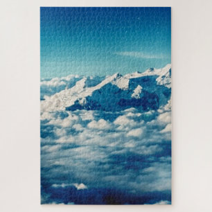 Puzzle Las montañas Himalayas en las nubes cielo azul