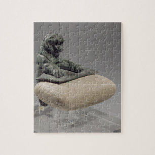 Puzzle León que sostiene una tableta de la fundación de