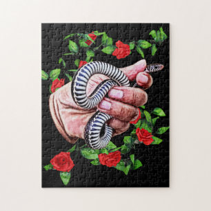 Puzzle mano sujetando la cita de la serpiente bebé animal