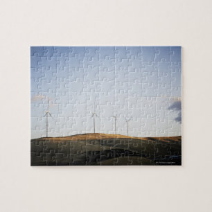 Puzzle Molinoes de viento en la colina en la puesta del